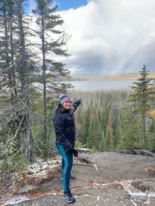 lady pointing to lake