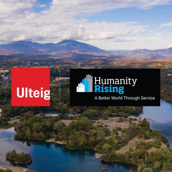 landscape photo of mountains and water with the LOGOs of Ulteig and Humanity Rising in the middle
