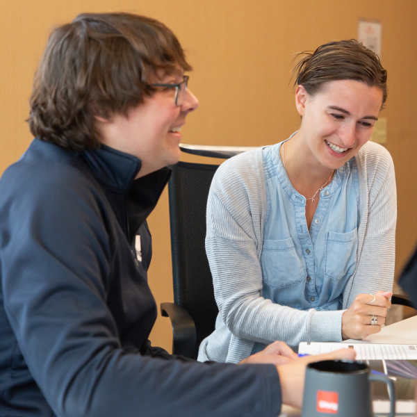 Two ulteig employees having a discussion