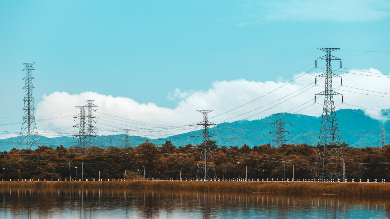 Transmission lines with mountain and clouds behind