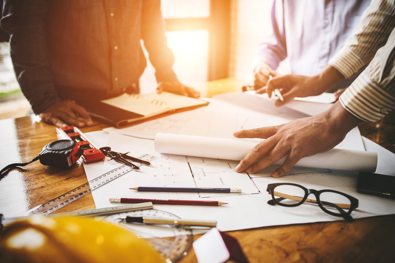 hands at a desk with paperwork